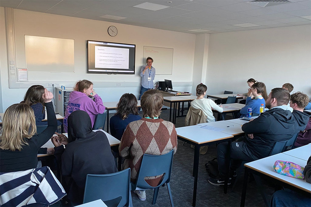 Photograph of students in a classroom listening to a talk by Dr Joel Smith