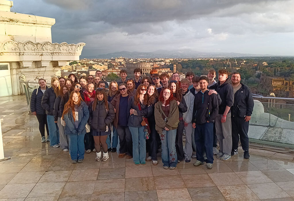 Photograph of students in Rome with the Colosseum in the distance