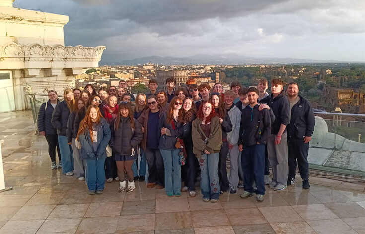 Photograph of students in Rome with the Colosseum in the distance